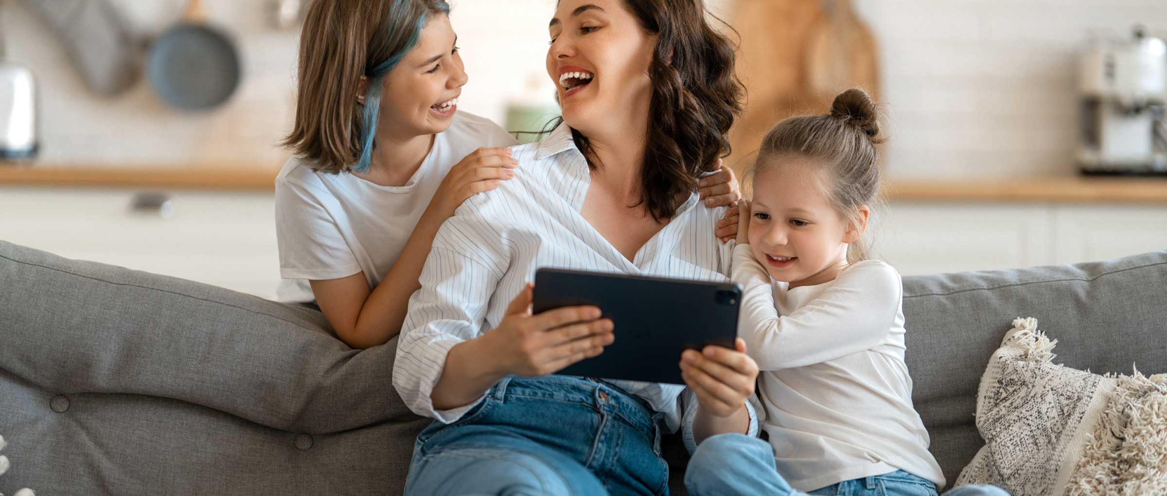 female with children looking at tablet